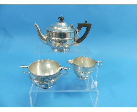 A late Victorian silver three piece Bachelor's Tea Set, by Holland, Aldwinckle &amp; Slater, hallmarked London, 1897 / 1898, 