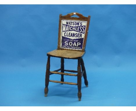 An Edwardian sycamore Watson's Matchless Cleanser Soap Grocer's Advertising Chair, the enamel advertising panel framed with a