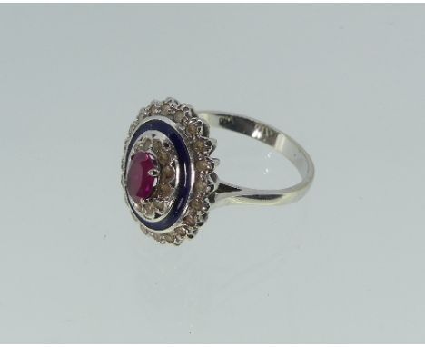 A dress Ring, of oval form with a central oval pink stone, surrounded by white paste, blue enamel and another outer row of wh