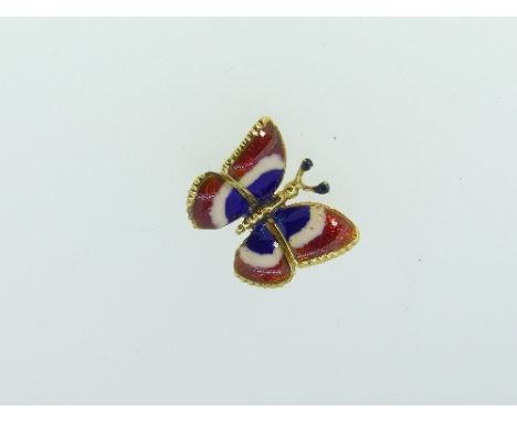 A small and attractive 18ct gold and enamel butterfly Brooch, the wings with guilloche enamel in red, white and blue, marked 