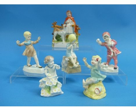 Five Royal Worcester porcelain figurines depicting children, modelled by F.G. Doughty, including January, December, Sunday's 