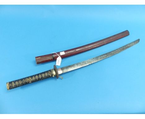 A Japanese Katana Sword, having shagreen &amp; leather bound handle, with brass mounted birds pommel and guard, with lacquere