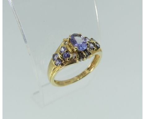 Two 9k yellow gold Dress Rings, each set with mauve stones and small diamond points, Size K½ (2)