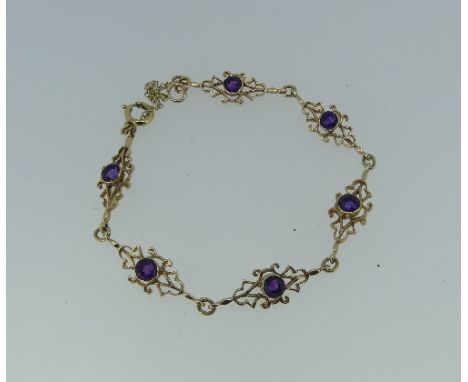 A 9ct yellow gold and amethyst Bracelet, formed of six openwork links, each set circular amethyst and with a single link betw