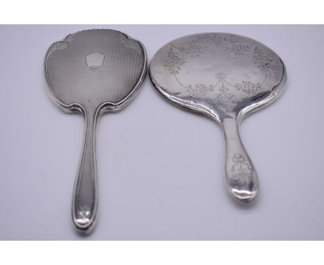 An engine turned silver hand mirror, by Adie Brothers Ltd, Birmingham 1963; together with one other. 