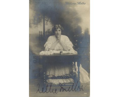 MELBA NELLIE: (1861-1931) Australian Soprano. A good vintage signed postcard photograph depicting the singer kneeling in a fu