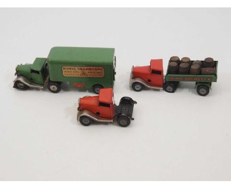 A pair of vintage TRIANG MINIC clockwork articulated lorries, comprising a Brewery and Removals example - together with anoth