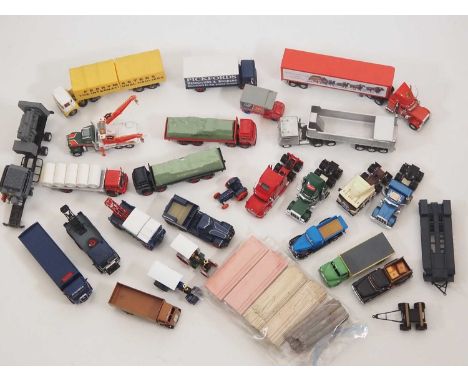 A large quantity of mostly 1:50 scale CORGI diecast lorries and vans together with a quantity of load and accessories, all un