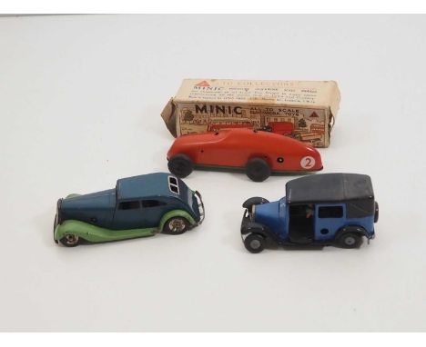 A group of vintage TRIANG MINIC clockwork vehicles comprising a boxed racing car and an unboxed car and taxi - F/G in P/F box