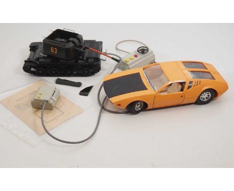 A pair of plastic and tinplate remote control vehicles comprising a De Tomaso Mangusta by unknown manufacturer (possibly East