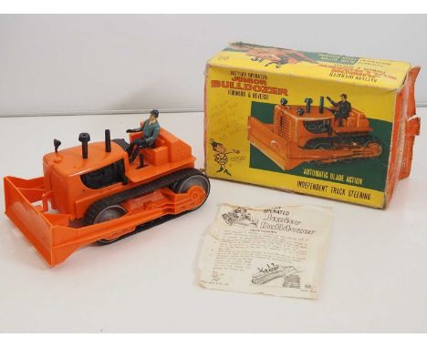 A LOUIS MARX plastic battery operated junior bulldozer in original box with packing piece - one headlight missing, but otherw