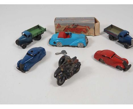 A group of vintage tinplate and elastolin vehicles to include a Lineol Hausser tinplate and elastolin motorcycle and sidecar 