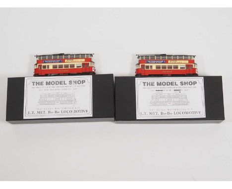 A pair of CORGI OOC London 1:76 (OO) diecast London Feltham trams, one motorised with a BEC kits motorising set, the other no