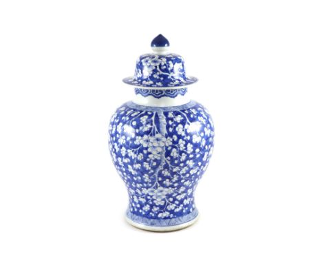 A good Chinese blue and white ‘prunus and cracked ice’ vase and cover, Kangxi period,with chevron borders, double circle to b