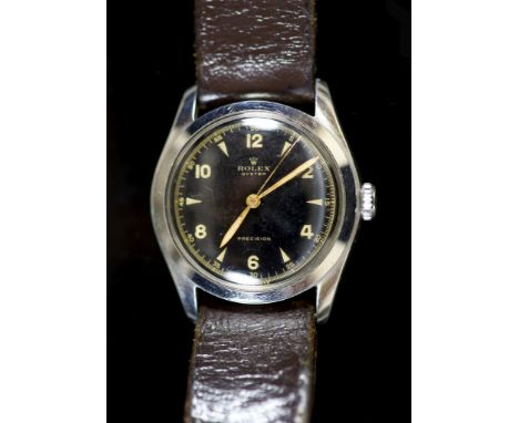 A gentleman's 1950's stainless steel Rolex Oyster precision manual wind wrist watchwith black dial and baton and Arabic numer