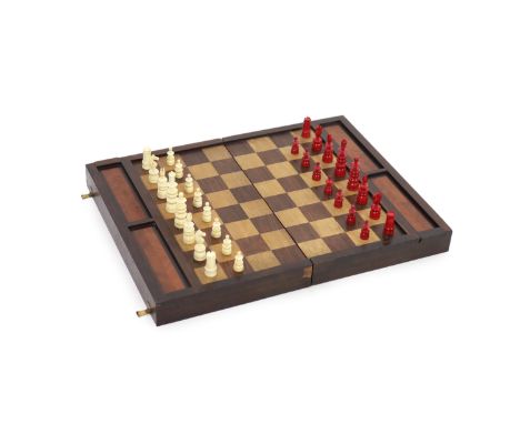 An early 20th century rosewood folding games board, external chess and internal backgammon,fitted with two sliding compartmen