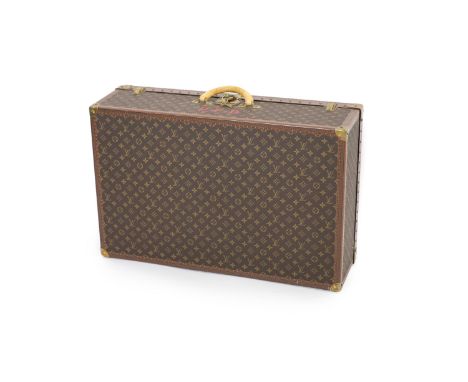 A modern Louis Vuitton Alzer 80 suitcase trunk,labelled LOUIS VUITTON PARIS serial number 1092***, The interior with fitted l