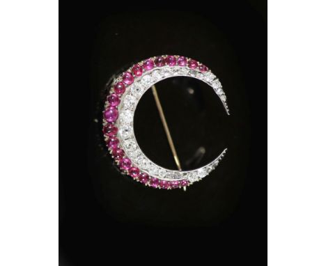 A late Victorian gold, graduated diamond and graduated cabochon ruby set two row crescent brooch,30mm, gross weight 5.7 grams