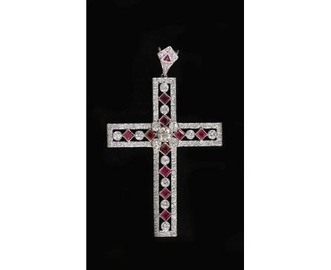 A modern pierced white gold, ruby and diamond cross pendant,set with round cut diamonds and square cut rubies, with ruby and 