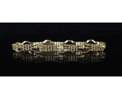 An Edwardian 15ct gold, three stone ruby and two stone diamond set fancy link bracelet,approx. 18cm, gross weight 12.1 grams.