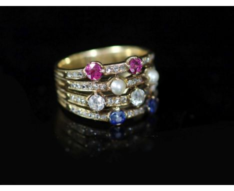 A mid 20th century gold, ruby, diamond sapphire and seed pearl set quadruple shank dress ring,with rose cut diamond setting, 