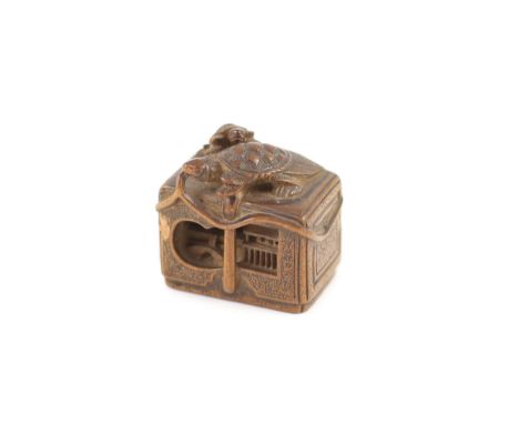 A Japanese boxwood netsuke of a minogame and young perched on the top of a fubako, signed Gyokoku, 19th century,3.5cm wide