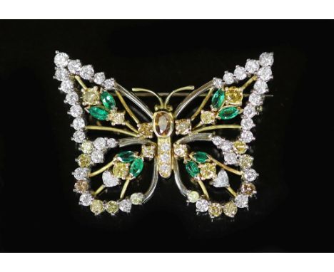 A modern white and yellow gold, diamond, emerald and citrine set open work butterfly brooch,diameter 44mm, gross weight 17 gr