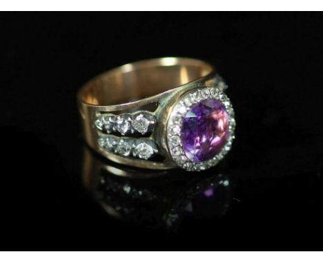 An antique gold, diamond and amethyst cluster ringset with a central foiled amethyst within a border of brilliants and pierce