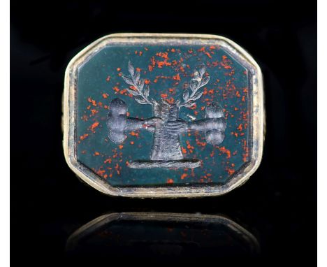 A 19th century gold overlaid and bloodstone set fob seal, the matrix carved with two arms grasping a tree trunk, hung from a 