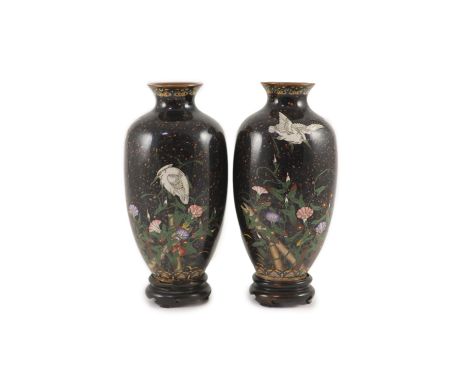A pair of Japanese silver wire cloisonné enamel ‘egret’ vases, Meiji period,each decorated with egrets and foliage on a ‘gold