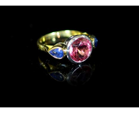 A Theo Fennell 18ct gold, collet set single stone pink tourmaline and two stone pear shaped sapphire set dress ring,size K, g