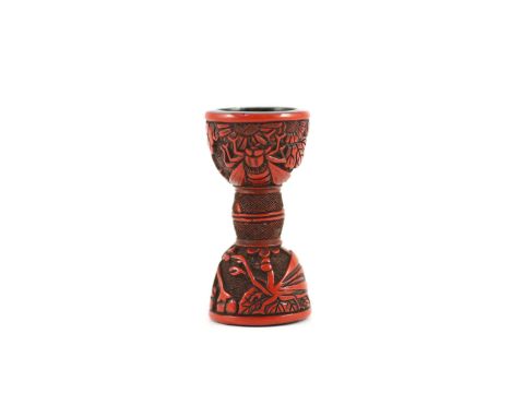 A Japanese red lacquer netsuke in the form of a hand drum (tsuzumi), early 19th century,carved in relief with a cicada, prayi