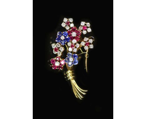 A 20th century French Van Cleef &amp; Arpels 18ct gold, ruby, sapphire and diamond cluster set floral spray clip brooch,set w