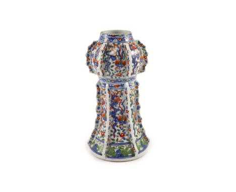 A Chinese wucai beaker vase, gu, Kangxi period,painted with dragons and phoenixes amid flowers and foliage, between projectin