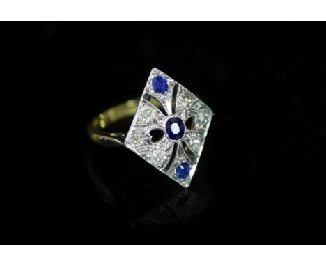 A 1920's/1930's 18ct gold and platinum, millegrain set sapphire and diamond pierced diamond shaped dress ring,size M, gross w