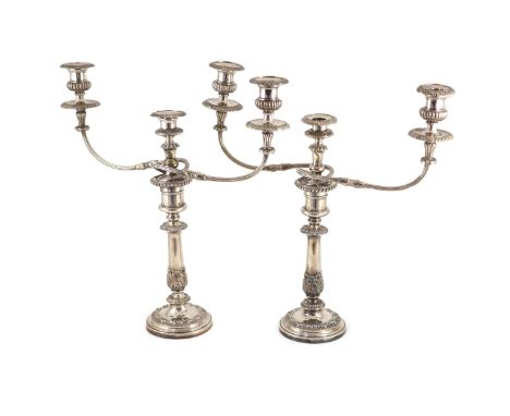 A pair of early to mid 20th century silver plated three light, two branch candelabra,with reeded arms and acanthus leaf decor