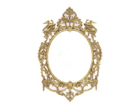 A 19th century Chippendale style gilt and gesso wall mirrorwith ornate foliate scroll frame capped with a pair of ho-ho birds