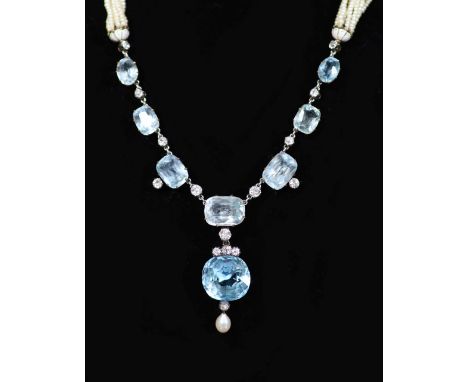 A 19th century gold and silver, aquamarine, diamond, pearl and enamel set multi strand seed pearl drop necklace,the large fan