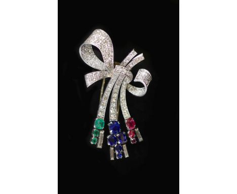 A mid 20th century Viennese platinum, ruby emerald, sapphire and diamond set stylised ribbon bow clip brooch,maker NE?, 55mm,