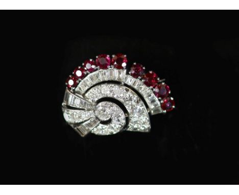 A mid 20th century white gold, ruby and diamond set fan shaped scroll brooch,set with graduated round and baguette cut diamon