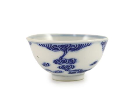 A Chinese blue and white bowl, Guangxu mark and period (1875-1908),painted with scrolling clouds, yet to receive its enamel d