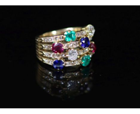 A gold, emerald, ruby, sapphire and diamond set quadruple shank dress ring,with diamond chip setting, size H/I, gross weight 