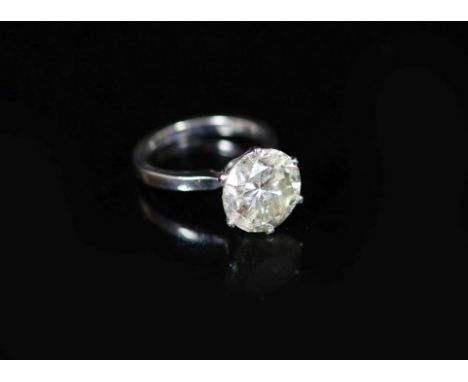 A modern 18ct white gold and solitaire diamond ring,the stone measuring 10.7mm in diameter, (no depth measurement due to sett