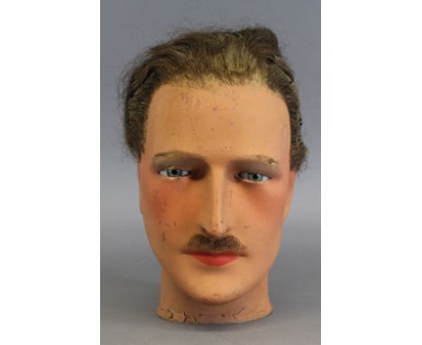 'Eric' - A 1920's/30's male mannequin wax head with hair, 25cm high (slight damage)