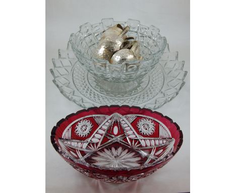 A Bohemian ruby overlaid cut glass bowl of elliptical form together with a circular moulded glass punch bowl with silvered cu