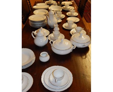 A Bavaria cream ground lustered part tea and dinner service, having silvered borders, to include tea pots, cups and saucers, 