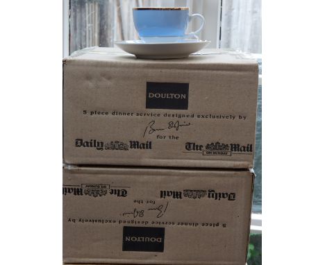 A Royal Doulton pale blue ground tea service with gilt heightening. 