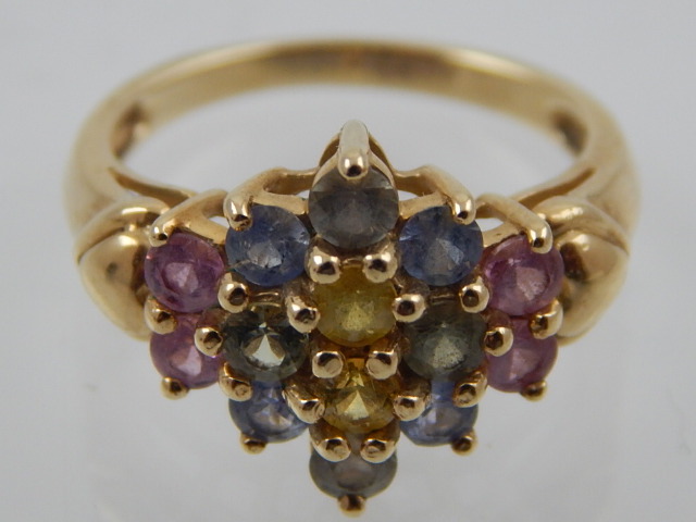 A 9 carat yellow gold and sapphire cluster ring, set blue, green, pink