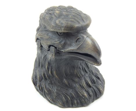 A vintage style inkwell modelled in the form of an eagles head, H. 8cm.