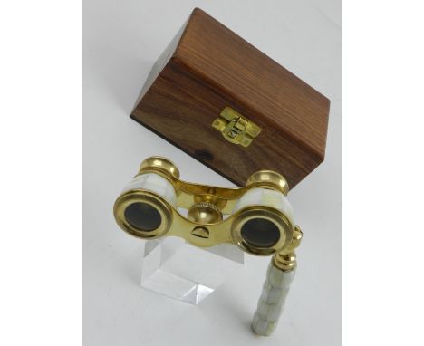 A pair of gilt metal opera glasses with mother of pearl inlay.